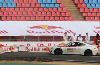 thum Whincup reverses out of the barriers after pushing the plastic wall into the concrete