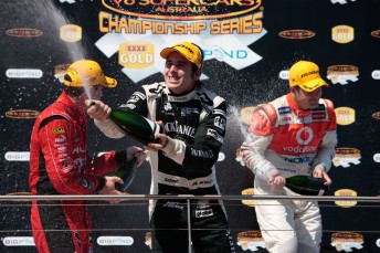 thumb Rick Kelly celebrates his second place on the Island podium with Garth Tander and Jamie Whincup