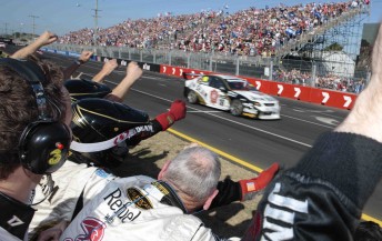 thumb James Courtney crosses the finish line to win last year's race on Sunday. More pit straight seat holders will be able to see this year's winner ...