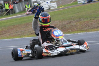 thumb Jason Hryniuk crossing the line for his third consecutive Clubman Heavy championship. Pic: Cooper's Photography