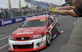 thumb Steve Owen crosses the line to secure his second Fujitsu V8 Series