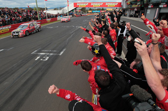car Garth Tander crosses the line to win the 2011 Bathurst 1000