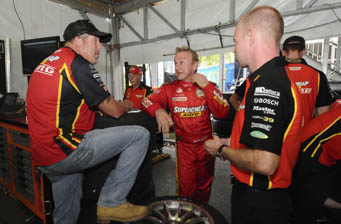 car Paul Morris (left) chats with Russell Ingall and Jan Magnussen