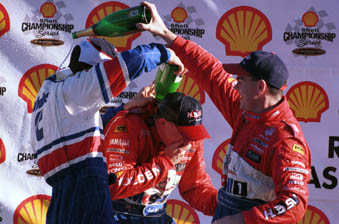 car Garth Tander, Mark Skaife and Craig Lowndes celebrate on the podium in 1999