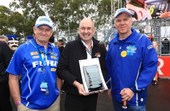 thumb David Spence - Hills Holdings (L) and Leon Andrewartha are presented with a trophy honouring Orrcon Steel's 10 years by Tony Cochrane, V8 Supercars Chairman