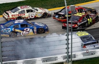 thumb Johnson (#48), Gordon (#24) and Bowyer (#15) spin at Turn 1