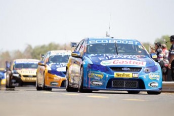 thumb Mark Winterbottom and Will Davison's FPR Falcons lead Steve Johnson's Jim Beam Ford down Hidden Valley's pit lane