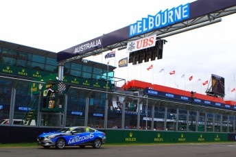 Brad Hodge takes the chequered flag