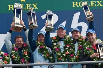 The AMR crew celebrate on the podium