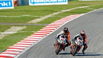 Marco Melandri defeats Aprilia team-mate Sylvain Guintoli at Sepang