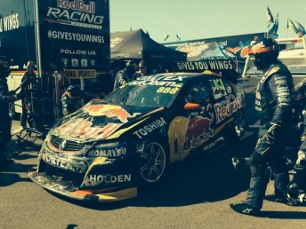 The Red Bull team rush to repair Lowndes' Holden for Race 21 later in the day