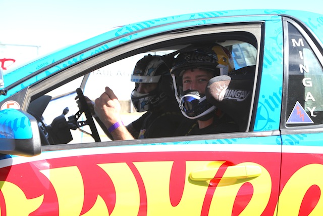 Travis Pastrana takes a ride with Matt Mingay in the Hot Wheels Ute at Queensland Raceway