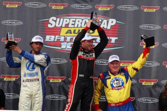 Ryan (left( standing on podium at the 2013 Bathurst event. Celebrating the 20th anniversary of his Father's Bathurst 1000 win with Larry Perkins