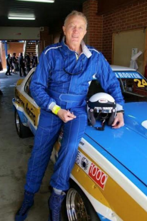 Phil Brock, posing with an original Team Brock Torana